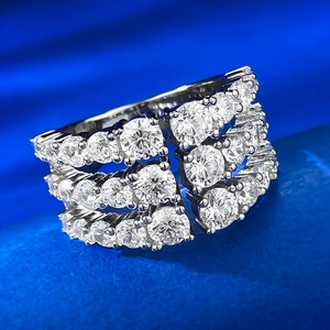 Macro detail of luxury triple-row pavé cubic zirconia ring with silver finish