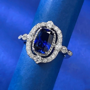Luxurious S925 silver ring with radiant cut blue sapphire and double diamond halo
