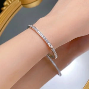 Close-up of elegant S925 sterling silver bangle with pavé-set round cubic zirconia stones