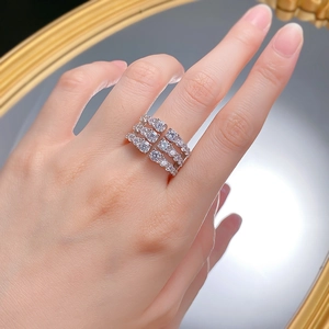 Detailed close-up of multilayer 925 silver ring with pear and round cut sparkling stones