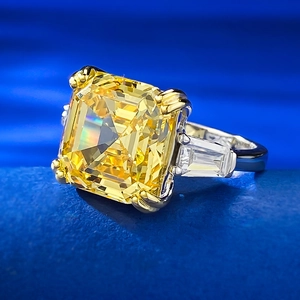 Macro shot of 925 silver ring featuring square yellow diamond and side stones