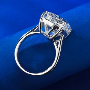 Macro side view of 6-carat ice flower cut faux diamond ring with hollow geometric silver band