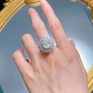 Macro detail of the halo setting with double layered diamonds and a large round center stone