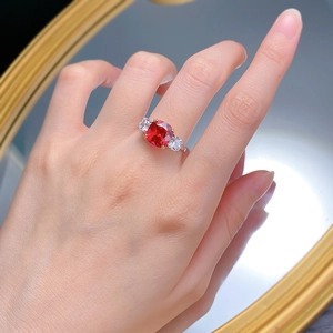 Luxurious S925 silver ring featuring a large square red ruby and side stones on a finger