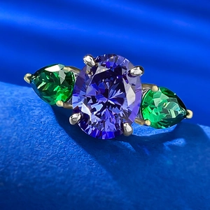S925 silver ring with oval tanzanite blue stone and pear-shaped green side gems