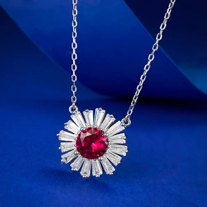 Macro detail of a sunflower shaped S925 silver necklace with a red pigeon blood ruby