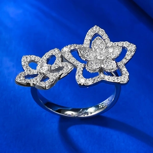 Macro shot of S925 silver stamp and sparkling zirconia petals on the hollow flower ring
