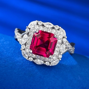 Macro shot of S925 silver ring featuring a large red gemstone with marquise diamond halo