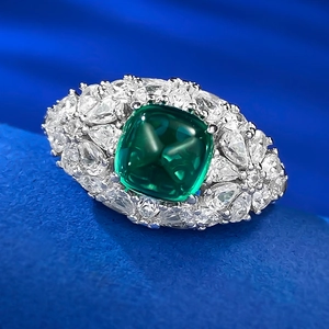 Detailed macro view of S925 silver ring featuring a green sugar-loaf emerald-cut gemstone