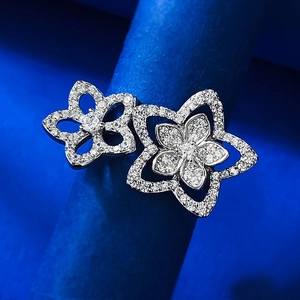 Macro shot of S925 silver hollow flower earrings with sparkling pavé cubic zirconia
