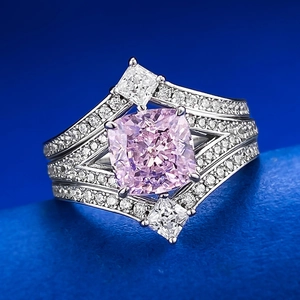 Macro detail of 925 silver crown ring with pink cushion cut stone and pavé setting