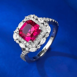 Detailed close-up of S925 silver ring featuring a square red ruby and brilliant cluster halo