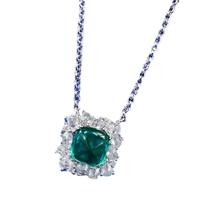 Silver necklace featuring a cushion cut emerald green gemstone pendant with diamond halo
