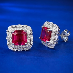 S925 silver stud earrings featuring ruby red center stones and a zircon halo