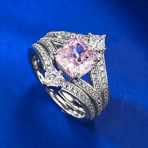 Macro detail of a 925 silver crown ring set with a pink cushion-cut stone and micro-pavé diamonds