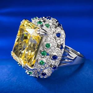 Radiant cut 15ct yellow diamond cocktail ring with colorful pavé gemstones