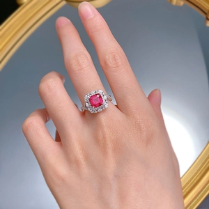 Close-up of S925 silver ring with pigeon blood red ruby and double halo diamonds
