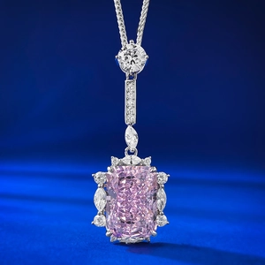 S925 silver necklace with radiant cut pink gemstone pendant on luxury blue satin background