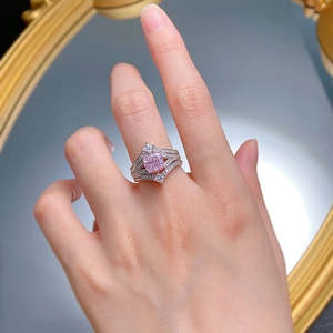 Close-up of a 925 silver crown ring with a cushion-cut pink gemstone and pavé diamonds