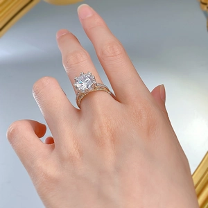 Macro shot of 925 silver bow-knot ring with a 3-carat diamond on a model hand