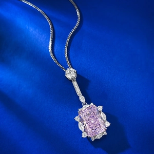 Detailed macro view of S925 silver necklace with radiant cut pink gemstone pendant