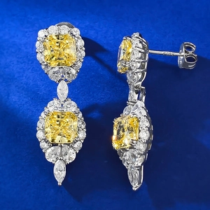 Macro detail of S925 sterling silver stamp on yellow diamond drop earrings with butterfly back