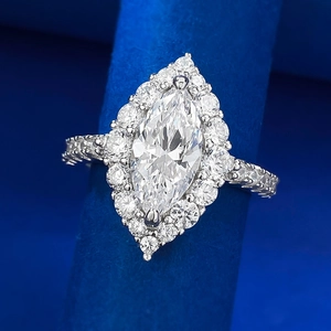 Marquise-cut halo engagement ring in silver featuring dual-layer ice-cut stones
