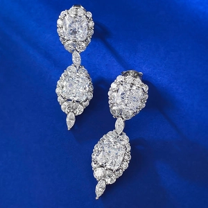 Macro detail of S925 sterling silver stamp and yellow square-cut diamond drop earrings