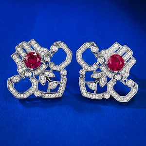 Detail of S925 silver stud earrings featuring round red ruby stones and micro-pave zircons