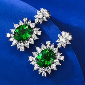 Luxurious S925 sterling silver stud earrings with oval emerald-cut green gemstones