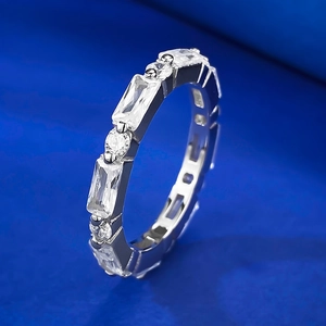 Elegant silver eternity ring with alternating baguette and round cut cubic zirconia stones