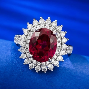 Elegant S925 silver oval ruby ring with radiant diamond halo on deep blue silk
