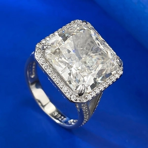 Macro view of S925 silver ring featuring square cushion-cut stone and pavé setting