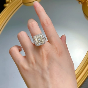 Close-up of a luxury S925 silver ring with a large cushion-cut yellow diamond solitaire