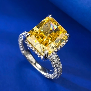 Detailed close-up of S925 silver ring featuring radiant cut yellow gemstone in 4-prong setting