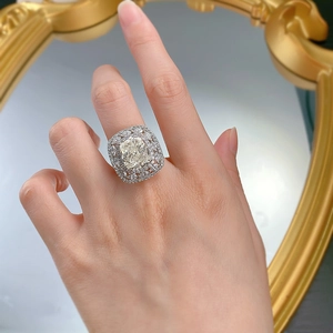 Close-up of a 5-carat cushion-cut yellow gemstone ring with luxury s925 silver setting