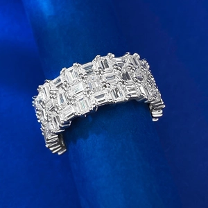 Detailed macro of a wide multi-row silver ring with emerald-cut baguette cubic zirconia