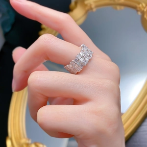 Three-row rectangular cut zircon eternity ring in silver finish worn on finger