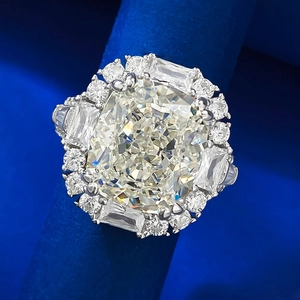 Exquisite cushion cut yellow high carbon diamond ring on premium blue velvet display