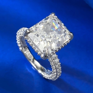 Macro shot of square radiant cut carbon diamond ring with S925 silver pavé band details