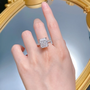 Macro detail of radiant cut S925 silver ring with micro-pave diamonds on model hand