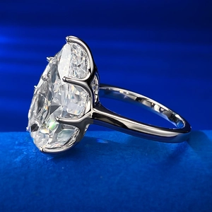 Sparkling S925 silver ring with a large oval-cut carbon diamond on blue velvet base