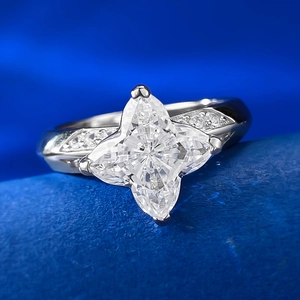 Macro shot of S925 silver ring featuring a large star-cut diamond and pavé set side stones