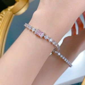 Close-up of S925 silver bracelet featuring ice cut pink gemstone and pavé diamonds