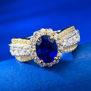 Lace-edge 925 silver ring with oval blue sapphire and pavé diamonds, macro view
