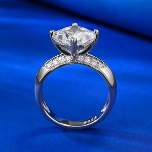 S925 sterling silver ring with large square cut clear stone on blue velvet surface