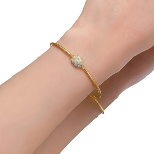 Bohemian gold brushed bracelet with oval pavé diamond center for men and women
