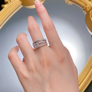 Macro shot of s925 silver multi-layer crisscross ring with sparkling cubic zirconia pavé