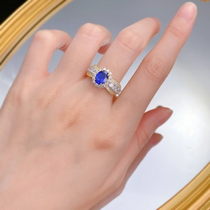 French lace 925 silver ring with oval blue sapphire and pavé diamonds on gold band