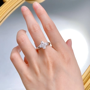 Elegant S925 silver flower ring featuring four marquise-cut carbon diamonds on a model